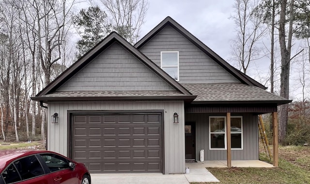 view of front of home featuring a porch and a garage