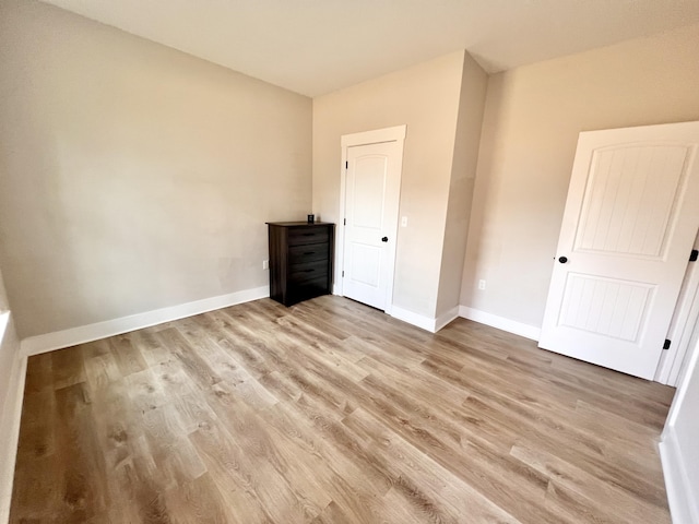 unfurnished bedroom with light hardwood / wood-style flooring