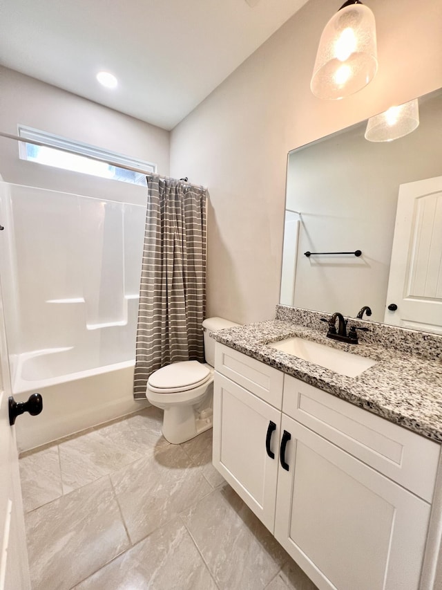 full bathroom featuring shower / bath combo, vanity, and toilet