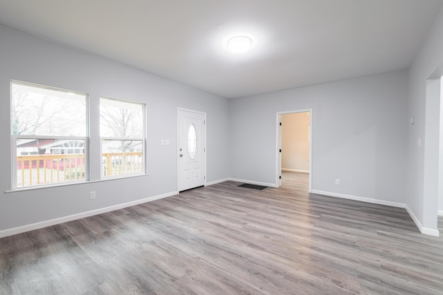 unfurnished room featuring light wood-type flooring