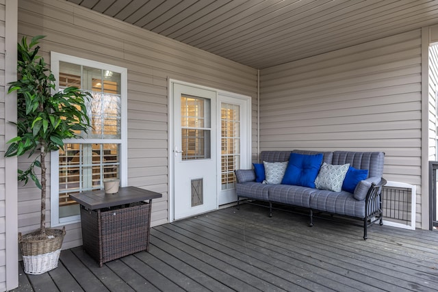 wooden terrace with outdoor lounge area