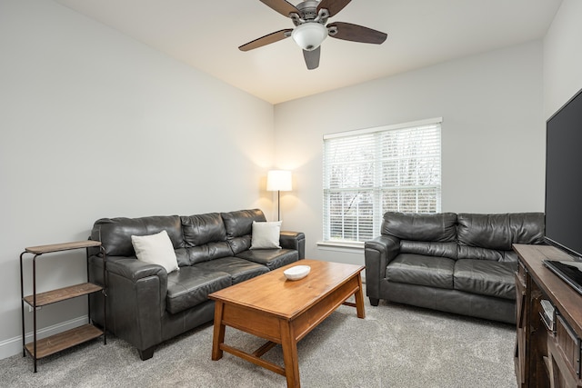 carpeted living room featuring ceiling fan