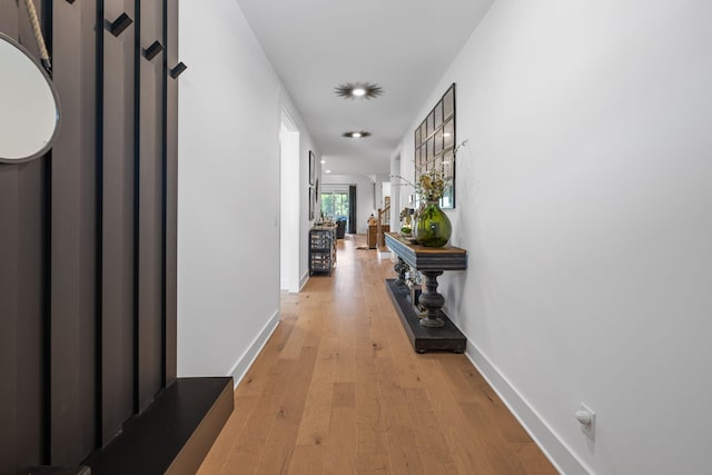 hall with light hardwood / wood-style floors