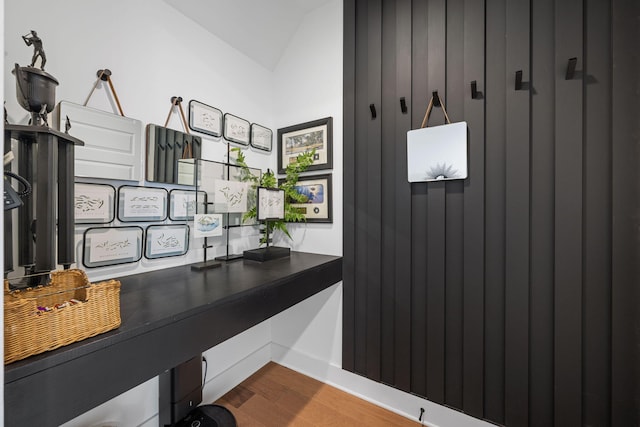 office space featuring hardwood / wood-style floors and lofted ceiling