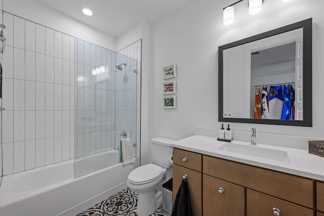 full bathroom featuring tile patterned flooring, vanity, toilet, and tiled shower / bath