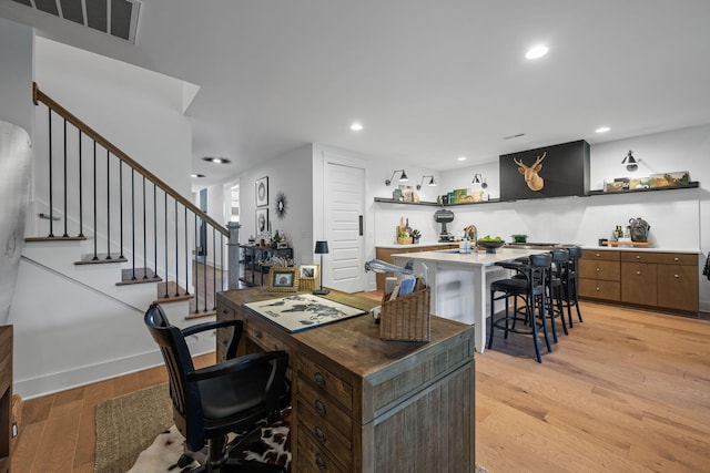 office space with light hardwood / wood-style floors