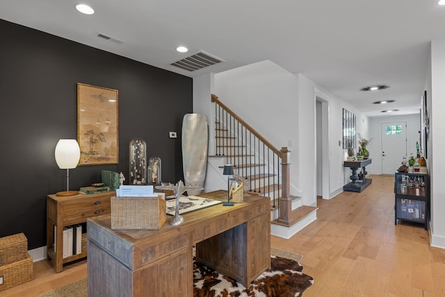 office area with light hardwood / wood-style floors