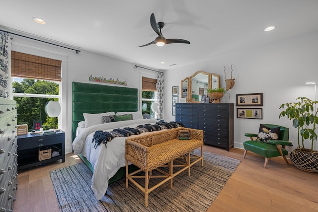 bedroom with ceiling fan and hardwood / wood-style flooring