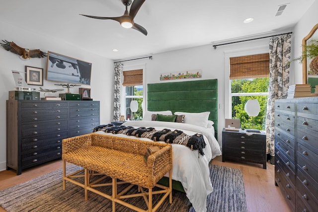 bedroom with light wood-type flooring and ceiling fan