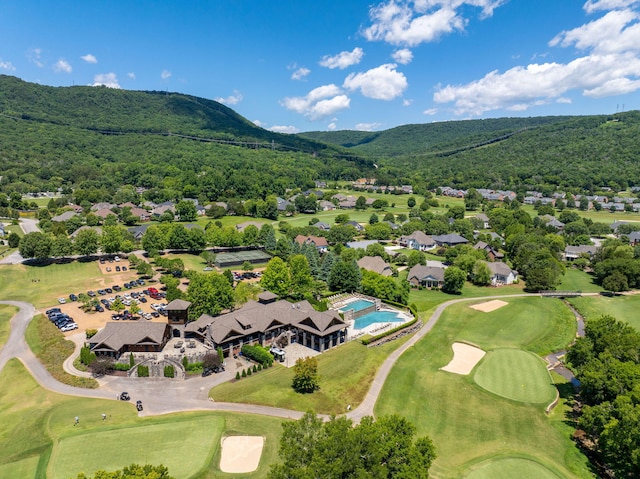 birds eye view of property with a mountain view