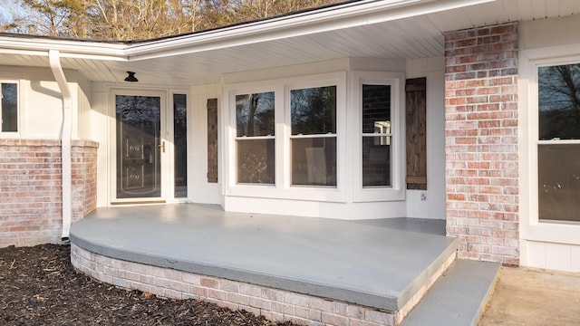 view of exterior entry featuring a porch