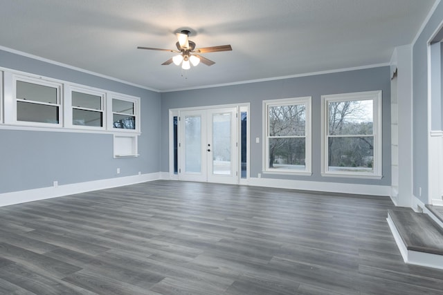 unfurnished living room with french doors, dark hardwood / wood-style floors, ceiling fan, and crown molding