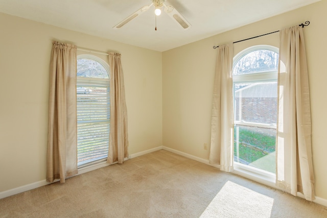 empty room with light carpet and ceiling fan