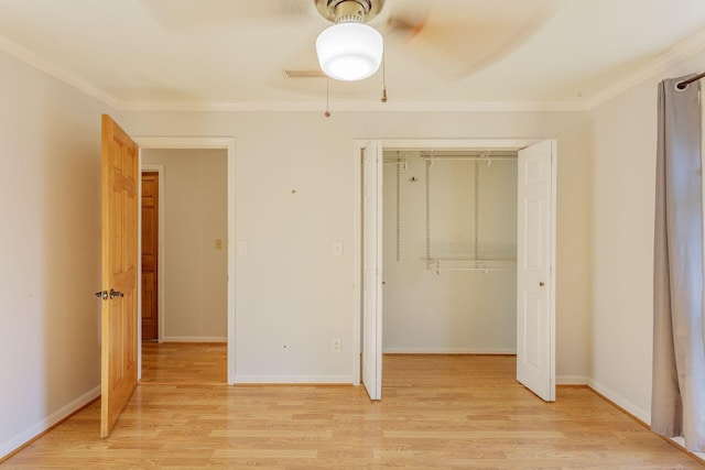 unfurnished bedroom with ceiling fan, a closet, crown molding, and light hardwood / wood-style floors