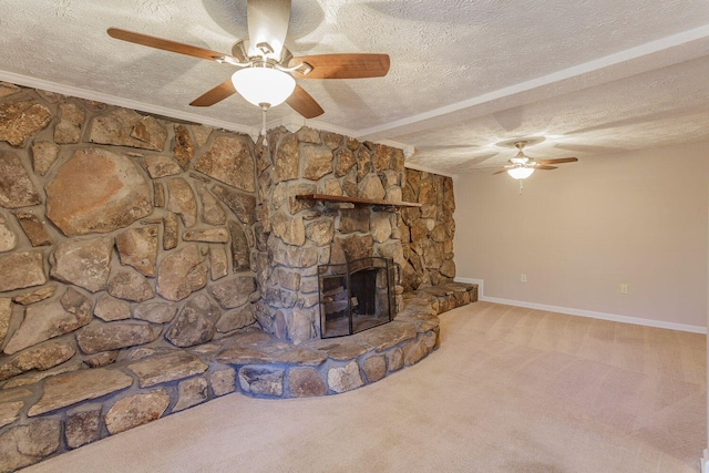 unfurnished living room with carpet flooring, a stone fireplace, crown molding, and a textured ceiling