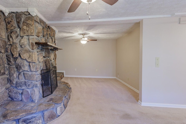 unfurnished living room featuring a fireplace, light colored carpet, ornamental molding, and a textured ceiling