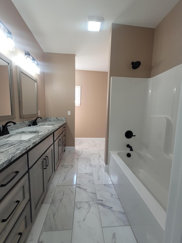 bathroom with shower / bathing tub combination and vanity