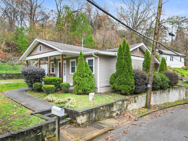 view of property exterior with covered porch