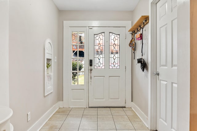 doorway with light tile patterned floors