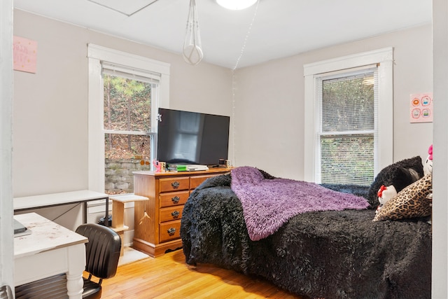 bedroom with light wood-type flooring