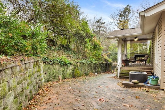 view of patio featuring a deck and central AC