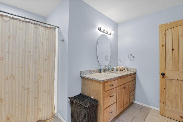 bathroom with tile patterned floors, vanity, and a shower with shower curtain