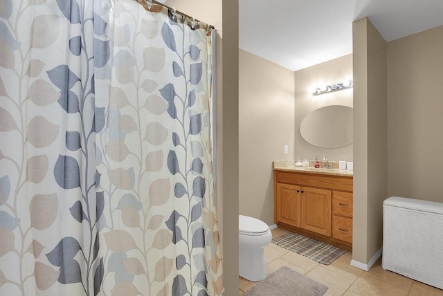 bathroom featuring tile patterned flooring, vanity, a shower with shower curtain, and toilet