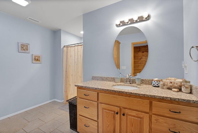 bathroom with vanity and tile patterned floors