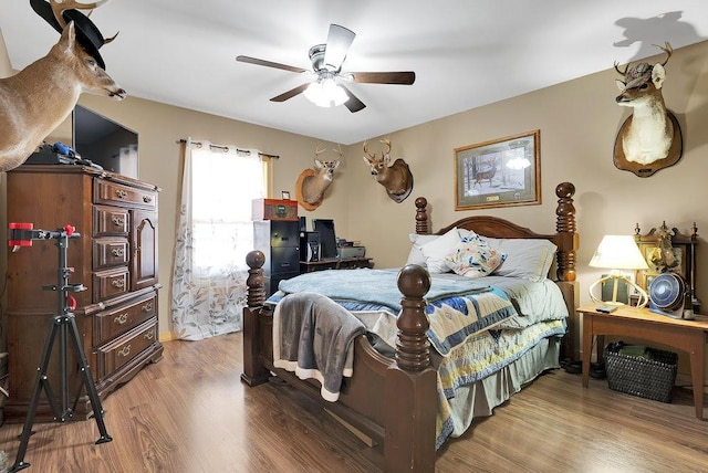 bedroom featuring ceiling fan and light hardwood / wood-style floors