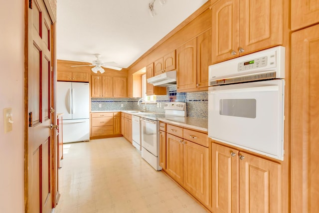 kitchen with white appliances, tasteful backsplash, ceiling fan, and sink