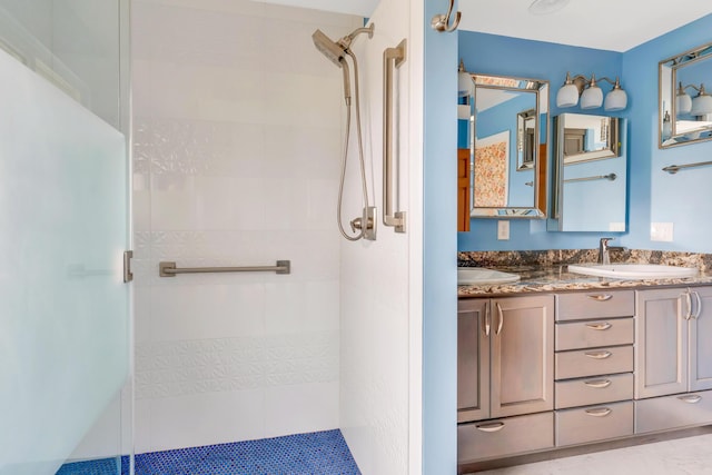 bathroom featuring vanity and a tile shower