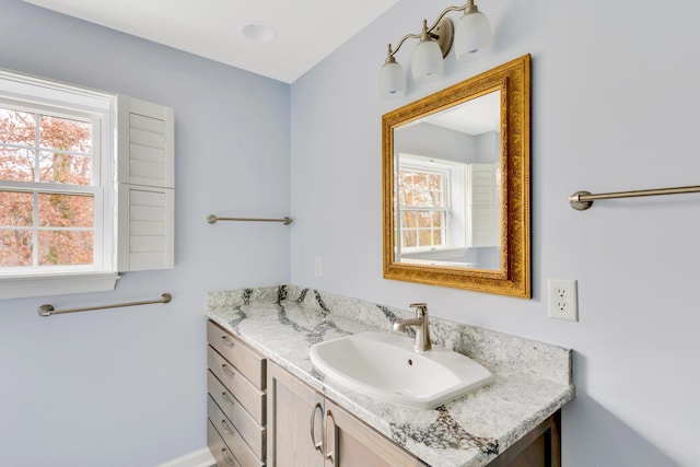 bathroom featuring vanity and a healthy amount of sunlight