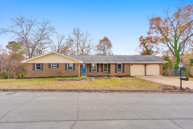 single story home with a front lawn and a garage