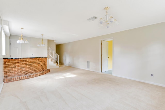 unfurnished living room with light carpet and a notable chandelier