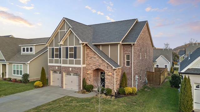 tudor house with a yard and a garage