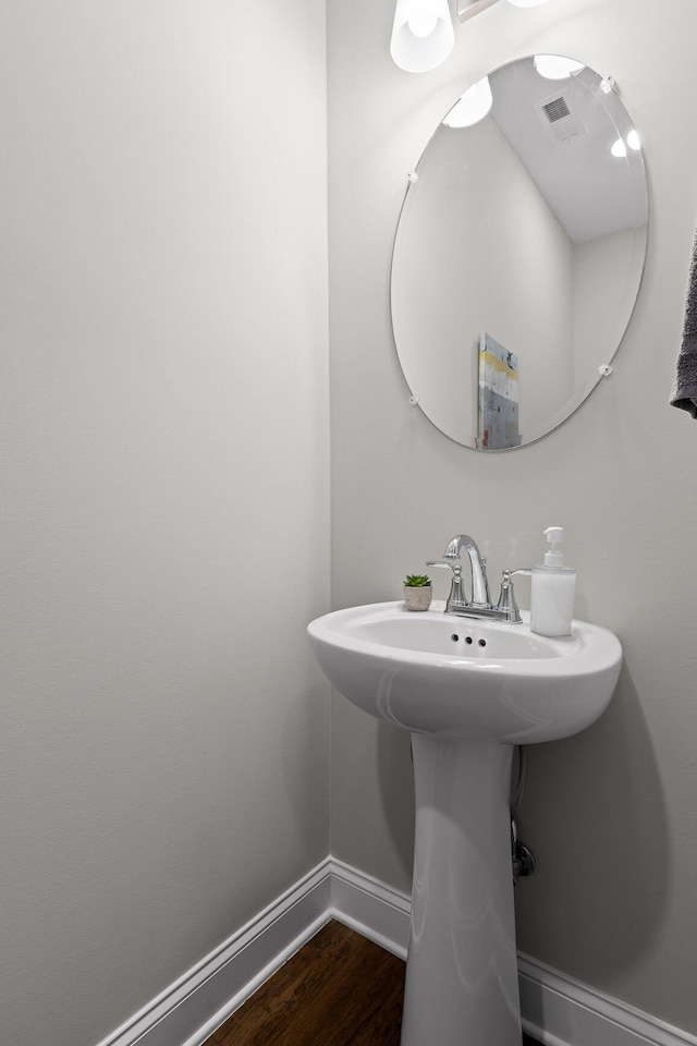 bathroom featuring hardwood / wood-style floors and sink