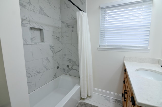 bathroom with shower / bath combo with shower curtain and vanity