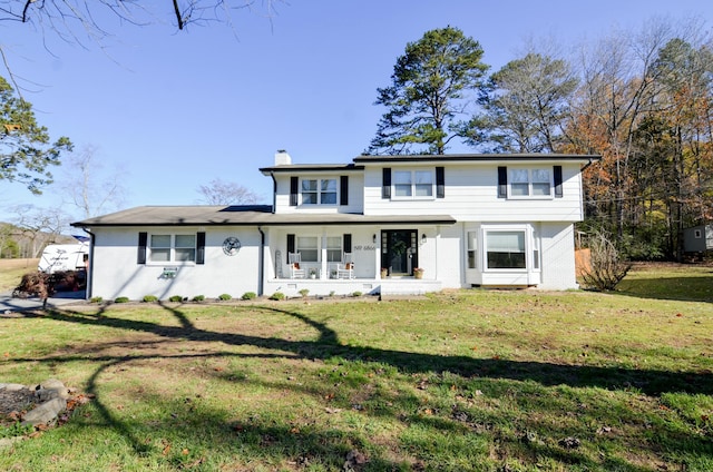 view of front of property with a front yard and a porch