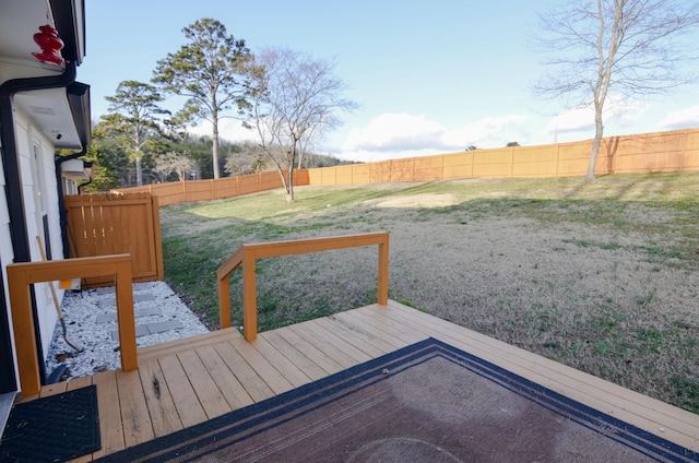 wooden deck with a lawn