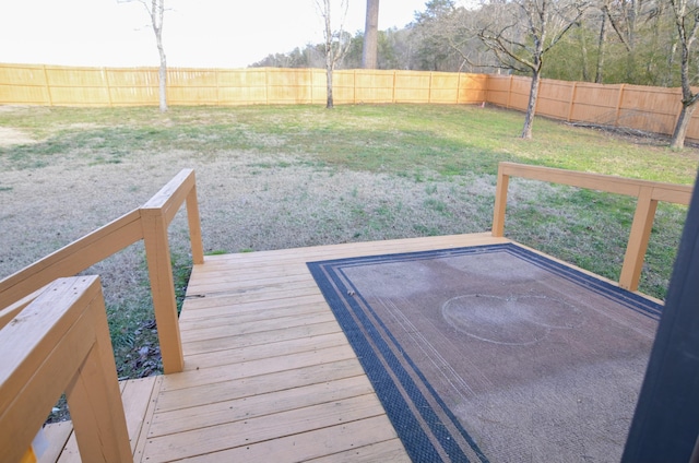 wooden terrace with a lawn