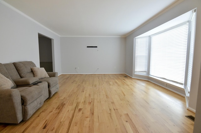 living room featuring light hardwood / wood-style flooring and ornamental molding