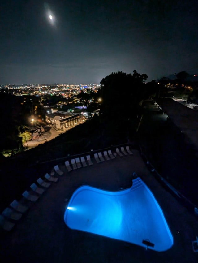 view of pool at night