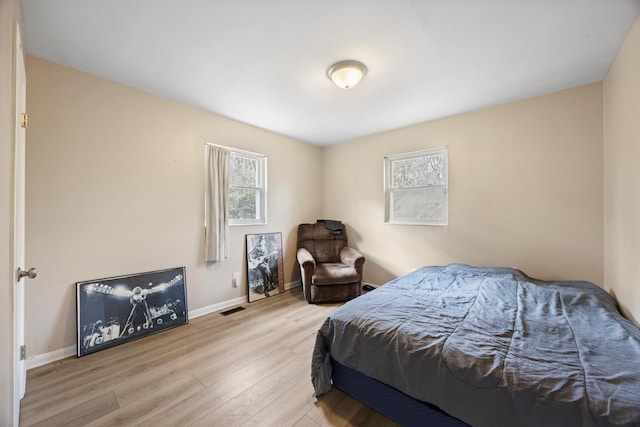 bedroom featuring light wood-type flooring