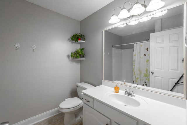 bathroom with vanity, toilet, curtained shower, and tile patterned flooring