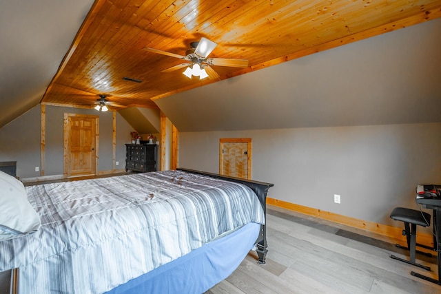 bedroom with ceiling fan, wooden ceiling, light wood-type flooring, and vaulted ceiling