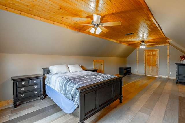 bedroom with ceiling fan, light hardwood / wood-style floors, wood ceiling, and vaulted ceiling