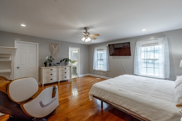 bedroom with light wood-type flooring and ceiling fan