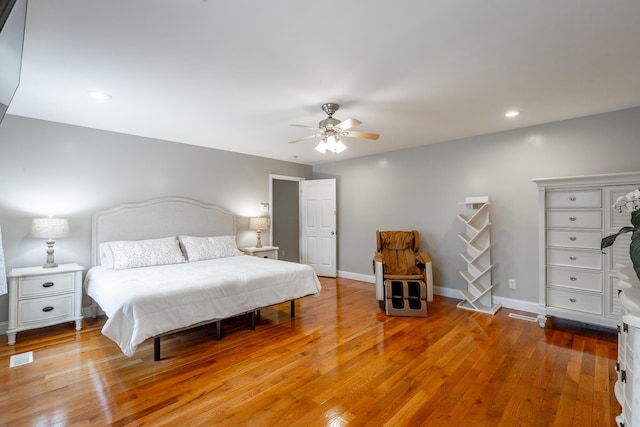 bedroom with ceiling fan and wood-type flooring