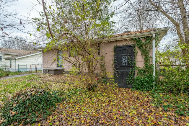 view of front of house with a storage shed