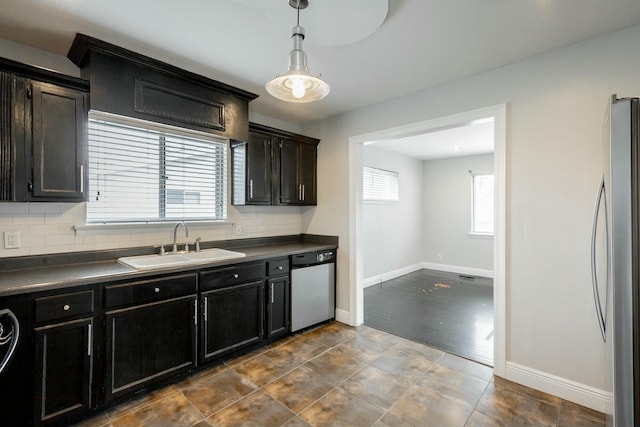 kitchen with decorative backsplash, dark hardwood / wood-style flooring, sink, and appliances with stainless steel finishes